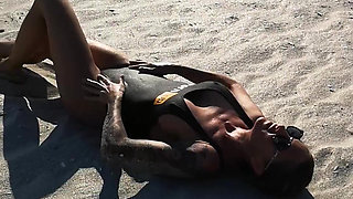 Hot babe teasing on the beach