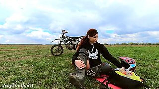 Naked woman riding a Dirt Bike