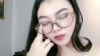Beautiful Asian Woman Shows Off Cleavage