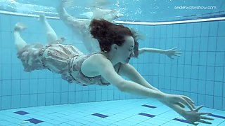Two hot hairy babes underwater