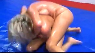 Oiled girls topless wrestling