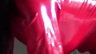 MILF in Red Latex Suit and Patent Leather High Heels Gives a Blowjob with Swallow