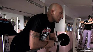 Hottie at the gym gets her cunt pleasured by two buffed dudes
