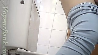 Lovely stranger chick in blue tight jeans filmed in the toilet room