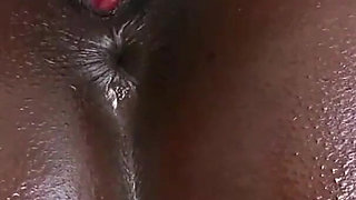 An oiled big ass ebony pounded in her pussy and milked on ass from BBC dude