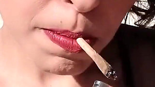 Smoking with Her Breasts Out