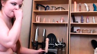 Redhead with a Big Ass Rides a Dildo on Webcam