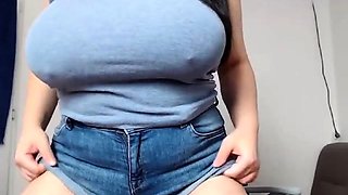 Hottie with giant boobs rubs cunt through shorts