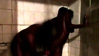 Big titty African babes go naughty fucking in the shower.