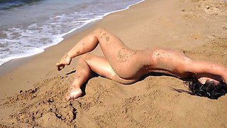 Seductive brunette Bettz poses on the beach and sucks a hard dick