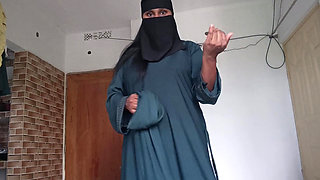 Shy muslim girl taking off burqa slowly