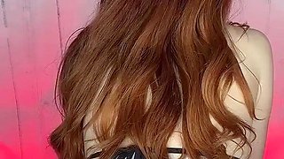 Amateur redhead Jacqueline with glasses masturbates
