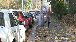 Brunette slut gets wild with public pissing & squirting in public