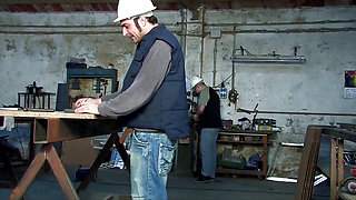 Two young sluts get fucked by workers in a garage