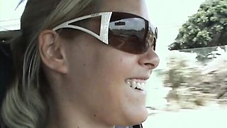 Good outdoor posing session on the beach with a busty Sophie Moone