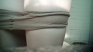 Pale skin chunky amateur lady in the toilet pissing