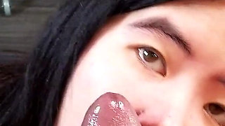 Chinese Girl Fits Her Tiny Mouth Around a Thick Black Cock