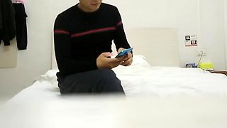 Cute amateur asian web cam girl playing with her toy