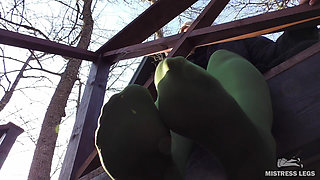 Goddess in Green Pantyhose Teases with Her Feet on the Porch