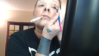 Doing make up dangling smoke