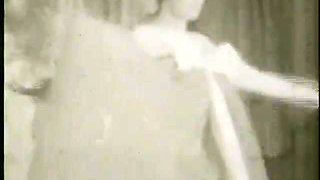 Strip-tease of a blonde woman in the sixties