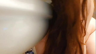 redhead slut humiliates herself by licking the toilet seat