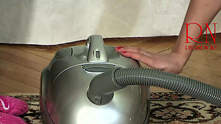 Maid Regina Noir cleans the apartment with a vacuum cleaner. 279 07 1