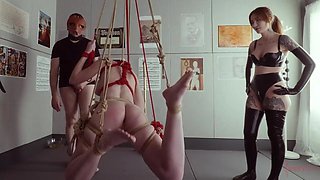 Busty blonde slave bound and hung for extreme BDSM sensations