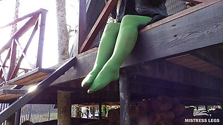 My nylon feet in green tights on your face