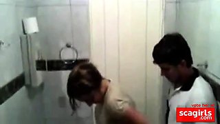 Hidden cam of party girl sucking boy in toilets