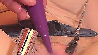 Tied in the Bathtub, the MILF Gets a Shower Stream at Her Clit While the Pussy Is Spread with Clamps