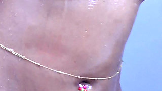 Young girl stripping and taking bath