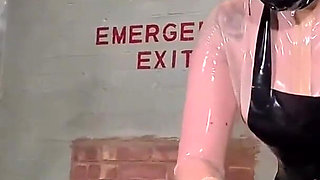 Latex Nurse inspects her gimp patient