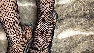 Fishnet in Open Toe Shoes with Red Nail Polish