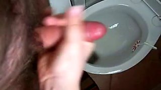 Fat wife of my friend wanks and sucks my dick in the bathroom
