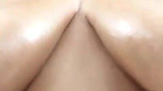 Huge Tits Oiled and Self Sucking