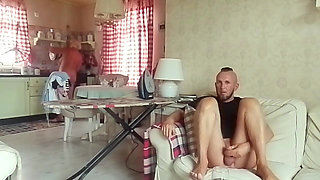 My stepmom is naked ironing laundry, and I watch a movie and jerk off to her.