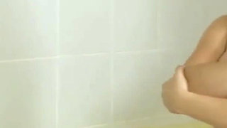 Busty brunette babe is pleasing her lover's hard cock with her big tits