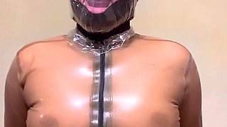 Plastic bag breathplay in latex, sweating and taking latex off
