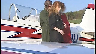 Stunning redhead slut gets outdoor fucked by pilot