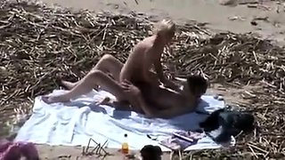 A Voyeur Films A Couple On Beach