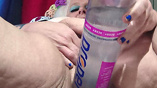 Big Bottle Plugged Clit Cunt