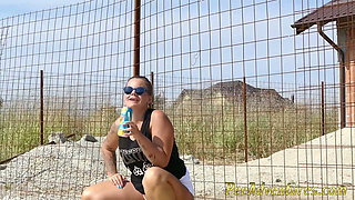 Pee standing on a dirt road in the countryside - Wet her panties outdoor and smoke until they dry