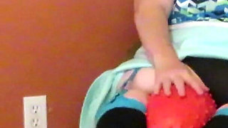 Nurse Vicki plays with a rubber ball in a mini skirt, sexy stockings and high heel mini boots