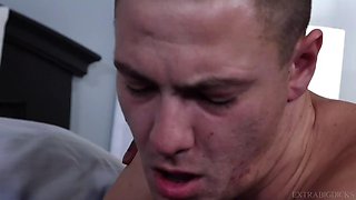 Muscular black getting frisky with a pale fellow