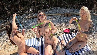 Two lesbian teens Cheri and abbie storm have fun on the beach