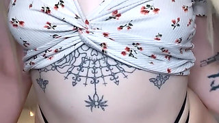 amateur tattooed blonde oils her pierced tits