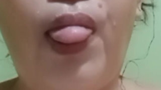 taking a bath and showing her beautiful face .