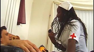Hot black nurse in stockings gets pounded and creamed by a white dude in bed