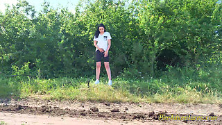 Sexy Brunette Trying Hard to Empty Her Bladder Outside, Then Quick Pee Next to a House in Construction